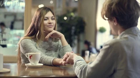 Student couple chatting together in a cafe Stock Footage 70909948