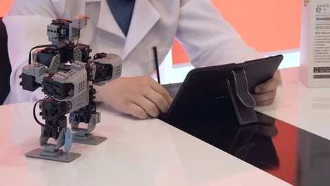 The student creates a robot in the laboratory Stock Footage 77265483