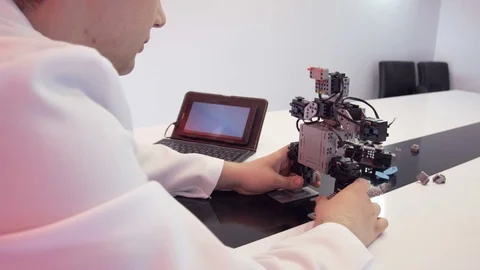 The student creates a robot in the laboratory Stock Footage 77268471