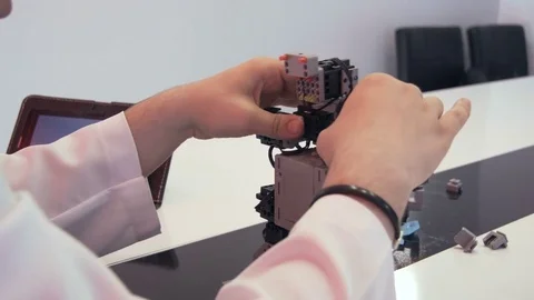 The student creates a robot in the laboratory Stock Footage 77268790