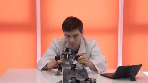 The student creates a robot in the laboratory Stock Footage 77269220
