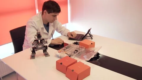 The student creates a robot in the laboratory Stock Footage 77270052