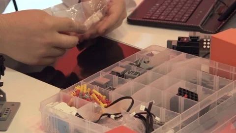 The student creates a robot in the laboratory Stock Footage 77270740