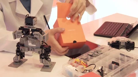 The student creates a robot in the laboratory Stock Footage 77270988