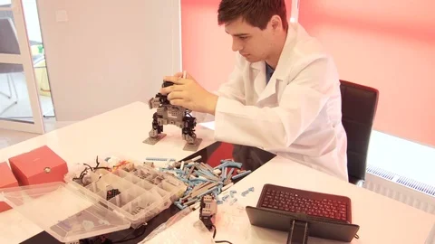 The student creates a robot in the laboratory Stock Footage 77272583