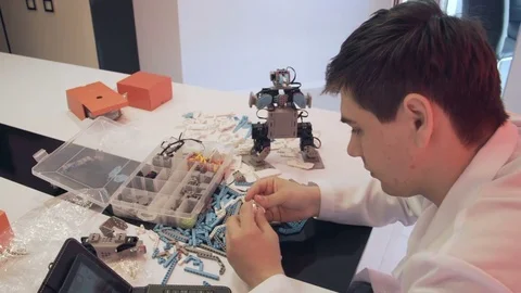 The student creates a robot in the laboratory Stock Footage 77416029
