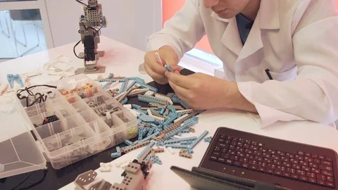 The student creates a robot in the laboratory Stock Footage 77417784
