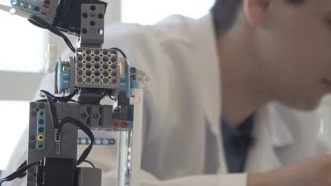 The student creates a robot in the laboratory Stock Footage 77419932