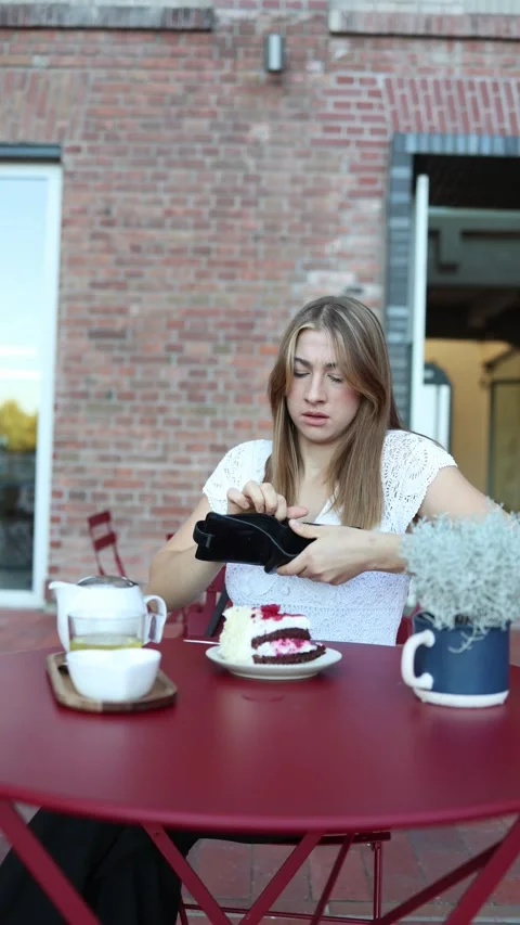 Student discovers her money was stolen after checking her empty wallet Stock Footage 344448338