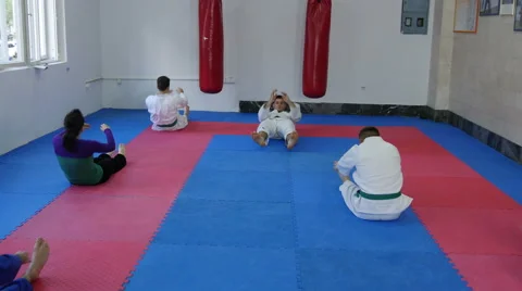 Student doing crunches on aikido training by Pakito 스톡 동영상 63879689