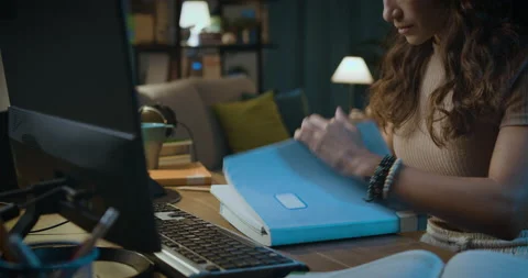 Student doing homework at night Stock Footage 162994373
