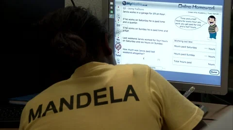 A student doing homework using a computer with a Mandela shirt. Stock Footage 47850323