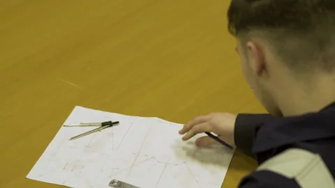Student Drawing Out Blueprints Vídeo Stock 152735768