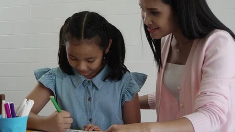 Student drawing picture in classroom Stock Footage 90248961