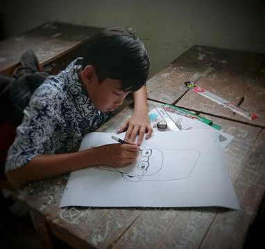 A Student is Drawing at School Stock Photos