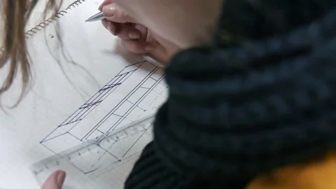 Student draws in a notebook Video stock 84688511