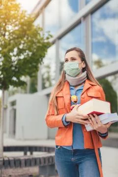 Student during covid-19 cannot enter closed university building Stock Photos