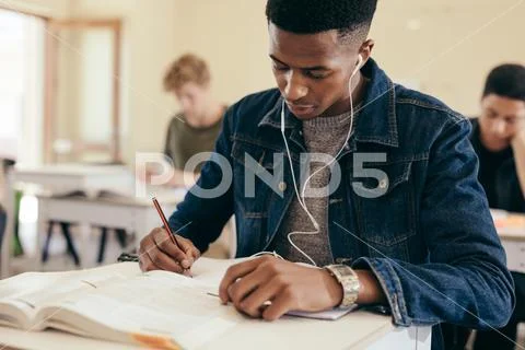 Student during lecture in college classroom Stock Photos