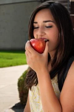 Student eating apple Stock Photos