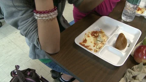 Student eating school bought lunch.  (2 of 2) Stock Footage 8697079