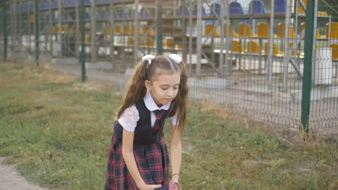 Student elementary school wears a backpack on his shoulders and goes home from 库存影片 116039782