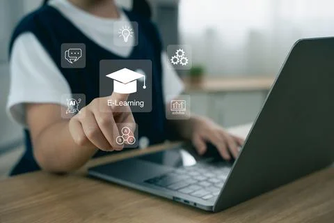 Student Engaging with E-Learning Technology and Digital Tools while Using L.. Fotos de archivo