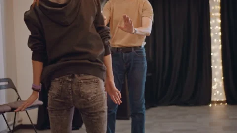 Student executes choreography with instructor guidance. Stage performer Stock Footage 346561488