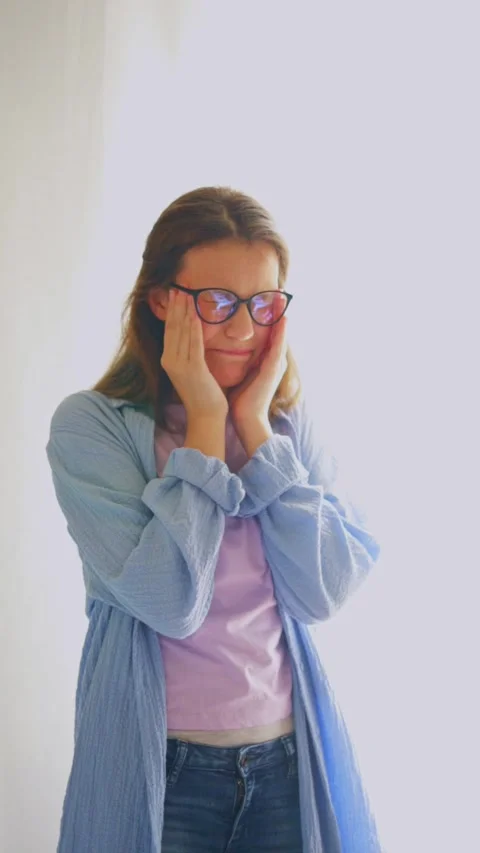 Student experiencing headache from study overload on white background. Great for Stock Footage 312640315