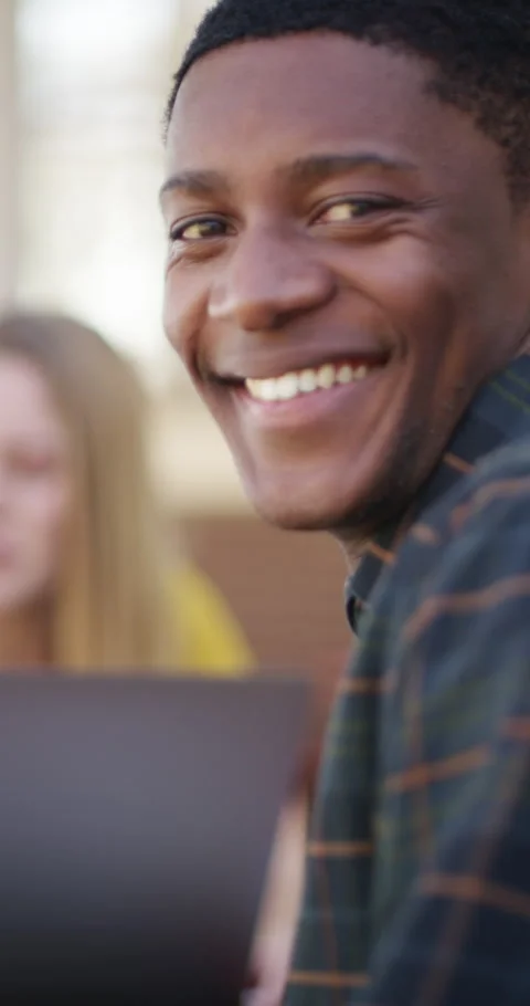 Student, face and happy man in library for education, learning and study with Stock Footage 334935477