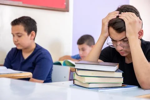 Student feeling frustrated due to the load of studying Stock Photos