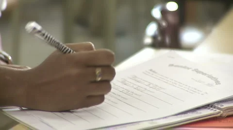 Student filling out a questionnaire Stock Footage 1077466