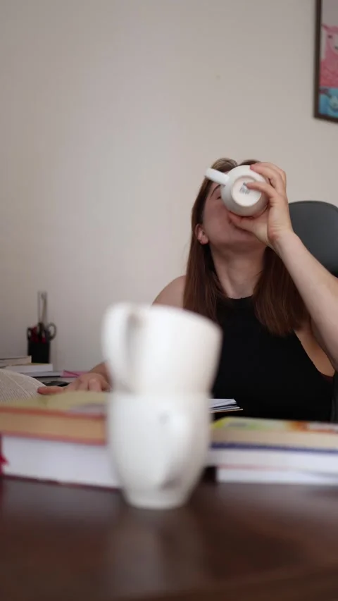 Student finds another empty coffee cup after hours of studying Stock-Footage 340087641
