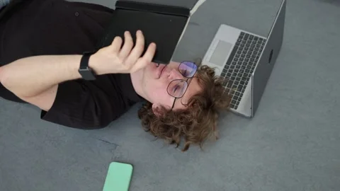 Student finishes homework on floor Stock Footage 338277378