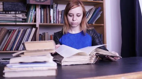 Student flips through the book Stock Photos