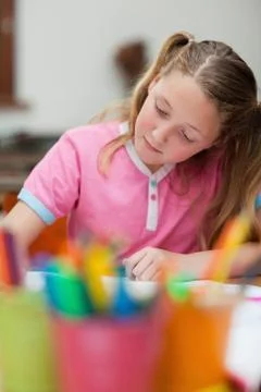 Student focused on her exercise book Fotos Stock