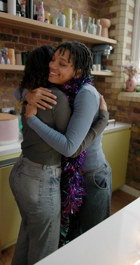 Student Friends Hugging whilst Decorating their Apartment for Christmas Stock Footage 297279906