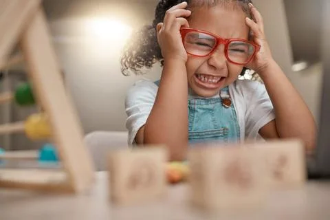 Student, frustrated and learning with education and headache, young child with 写真素材