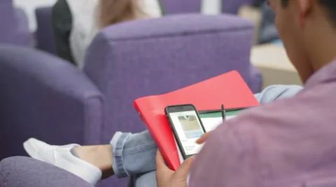 A student gets caught using his cell phone in class Video stock 55108863