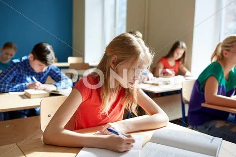 Student girl with book writing school test Stock Photos