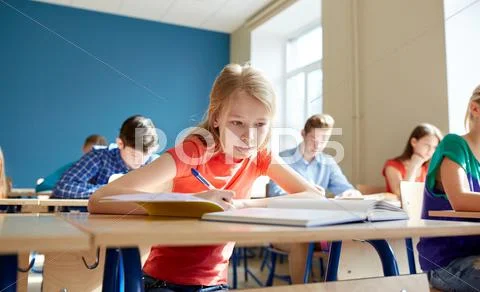 Student girl with book writing school test Stock Photos