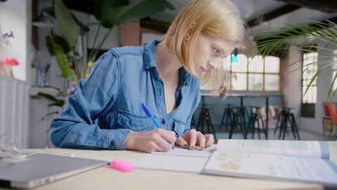 Student girl doing exercises studying hard focused preparing for final exams Stock Footage 103285322