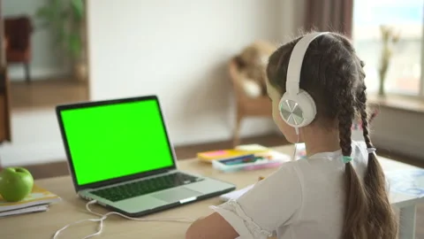 Student girl e-learning with green screen laptop, chat on video call Spbd. Kid Stock Footage 156526070