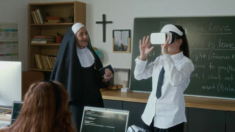 Student Girl Having Immersive Experience in VR Headset in Religious Class Stock Footage 311808852