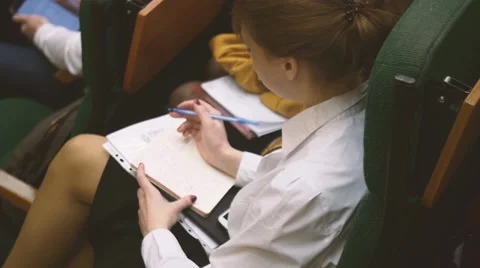 A student girl at a lecture Stock Footage 64344948