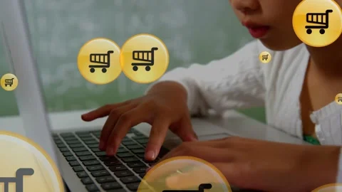 Student girl typing on laptop while animated cart icons appearing over hands Stock Footage 335465368