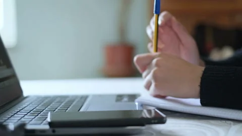Student girl while doing school lesson video call on a laptop,social isolation Video stock 150697491