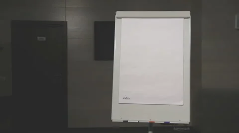 The student goes to answer. The young man with a flip-chart Stock-Footage 67307700