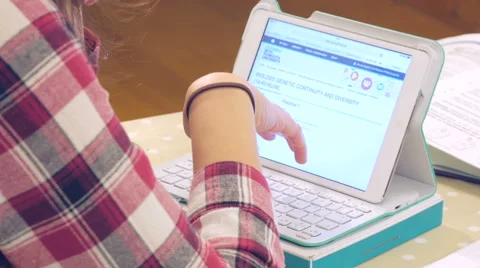 Student going over notes for her biology essay on Ipad Stock Footage 47015543