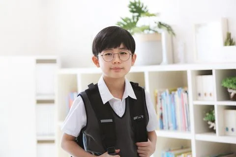Student going to school carrying a backpack for the new semester Stock-Fotos