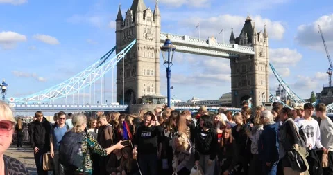 Student group posing by Tower Bridge on a sunny London day Stock Footage 321017220